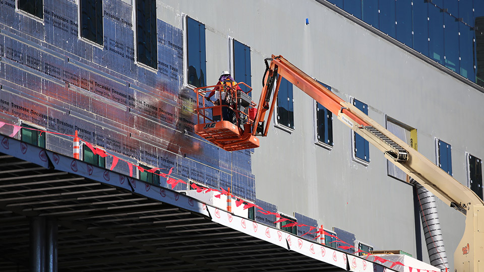 Contractors install a Firestone Building Products Enverge Cavity Wall insulation system at the University of Colorado’s new Academic Building in Denver.