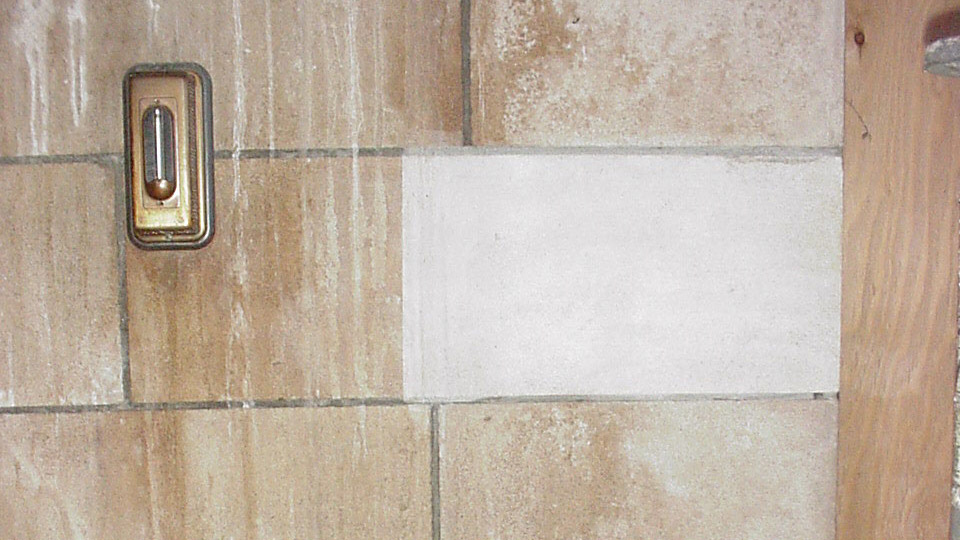 Mineral deposits from leak are cleaned.