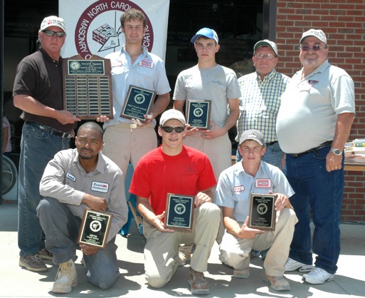 Shown bottom (left to right): Fifth-place finisher, Lamar O???Neal, Brodie Contractors; fourth-place finisher and 2010 defending champion Cory Huneycutt, Paul???s Masonry; and third-place finisher, Landon Huntley, McGee Brothers. Top (left to right), Contest Chairman Gary Joyner; 2011 Champion Wriston McGee; second-place finisher Kale Hallman of McGee Brothers; Contest Head Judge Freddy Koontz; and NCMCA President Larry Kirby.