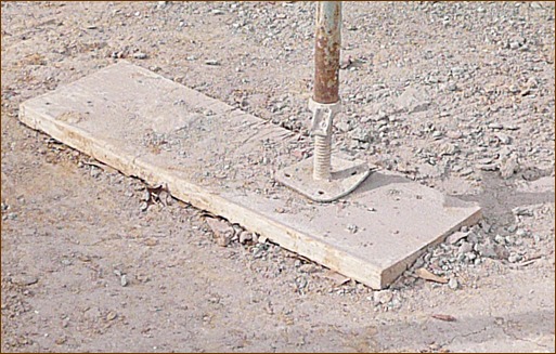 Photo 1: Short mud sills reduce shovel work and insure that they won???t be re-used for scaffold planks.