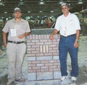 Caleb Soley (l) and his instructor and father, Porter Soley, (r) relax in front of Caleb's composite project.  Caleb, the fourth of four Soley sons who all competed in the national contest, finished in seventh place in the 2012 National Masonry Contest held in conjunction with the SkillsUSA National Leadership and Skills Conference in Kansas City, Mo.