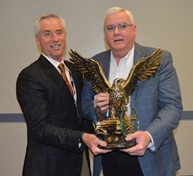 MCAA Chairman Mark Kemp presents the Leadman Award to John Smith Jr.