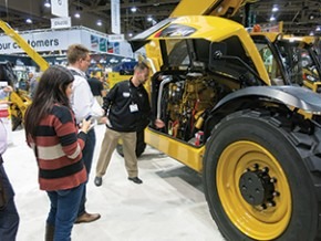 Caterpillar’s Mike Peterson takes onlookers on a tour of the company’s new telehandler.