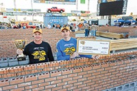North Carolina mason Garrett Hood (right) won the 2015 SPEC MIX TOP CRAFTSMAN award and 2nd place overall by laying 723 bricks with his mason tender, Ed Huntley (left).