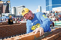 Mason Fred Campbell focusing as he lays another line of bricks in his winning wall