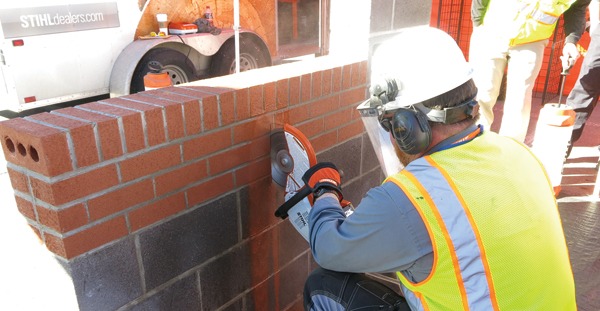 Dan Hull easily cuts through brick and block with this saw from Stihl, which uses water to prevent dust from becoming airborne.
