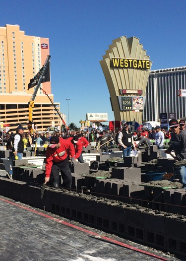 Journeyman masons and their tenders compete in a 20-minute heat in the Fastest Trowel on the Block competition.