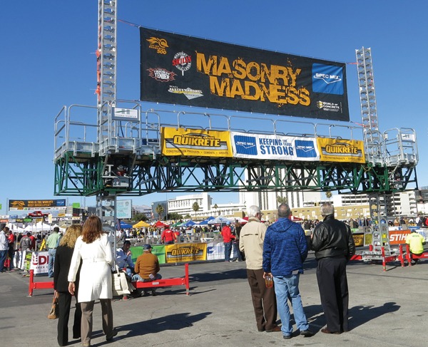 Spectators walk into the Masonry Madness area of the Gold Lot to watch the day’s competitions.