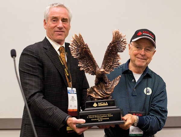 MCAA Chairman Mark Kemp (left) presents Charles Newsome (right) with the C. DeWitt Brown Leadman Award.